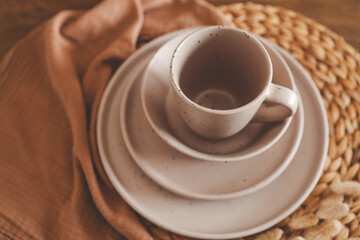 Stylish set of beige dishes close-up
