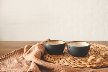 Two small stylish plates on a white background