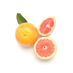 Composition with whole and cut grapefruits isolated on white background