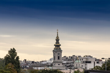 Saint Michael Cathedral, also known as Saborna Crkva, with its iconic clocktower seen from a street of Stari Grad district. It is one of the main landmarks of Belgrade, Serbia.