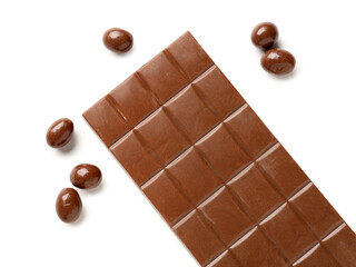Sweet chocolate bar and candies on white background