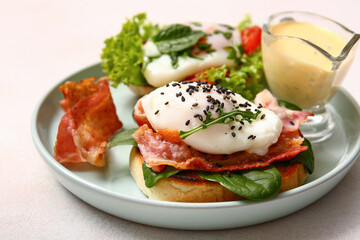 Plate with tasty egg Benedict on white table, closeup