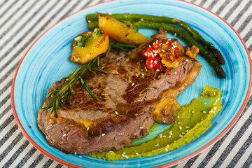 Veal with baked vegetables is tasty dish in the kitchen.