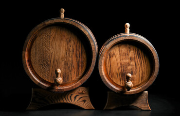 Wooden barrels on dark background