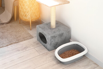 Litter box for cat and scratching post in room