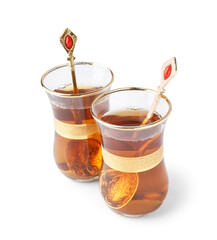 Glass cups of Turkish tea on white background