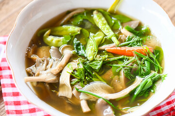 Mushroom curry with chili vegetable, Thaifood spicy grey oyster mushroom soup on bowl food with Melientha suavis