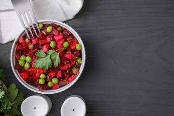 Delicious vinaigrette salad on grey wooden table, flat lay. Space for text
