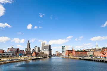 A view of Providence, Rhode Island showcasing a modern cityscape with towering skyscrapers, bustling streets and a thriving urban environment. A perfect representation of the modern metropolis.