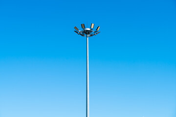 spotlight pole with blue sky