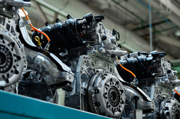 Car internal combustion engines stand on racks in warehouse