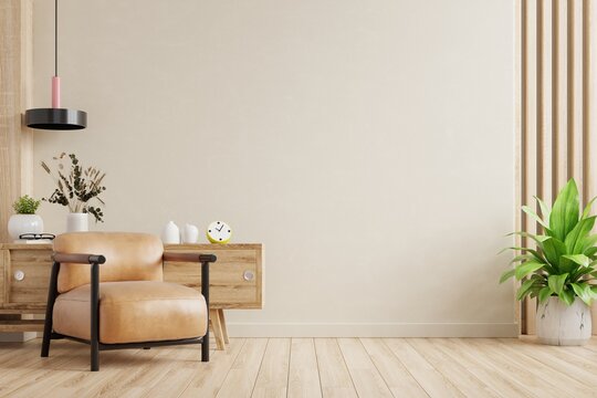 Cream room wall mock up in warm tones with leather armchair and decoration minimal.3d rendering