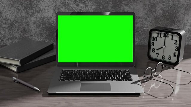 Laptop Mock-Up black color on work desk with notebook, alarm clock and eyeglasses. Designed in dark tone. Can be used for background in education or business. Green screen and Animation, 3D Render.