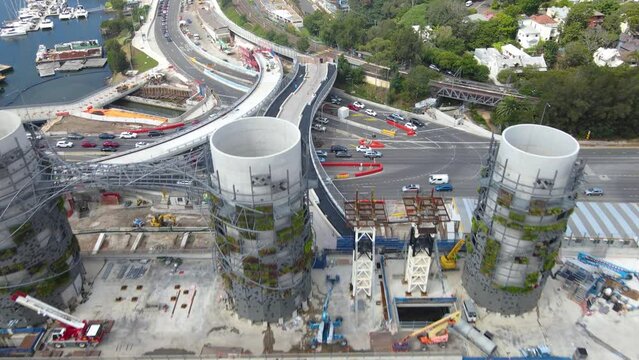 Aerial drone flyover of the large ventilation chimney towers at Rozelle Interchange in Sydney NSW Australia showing major construction works in March 2023  