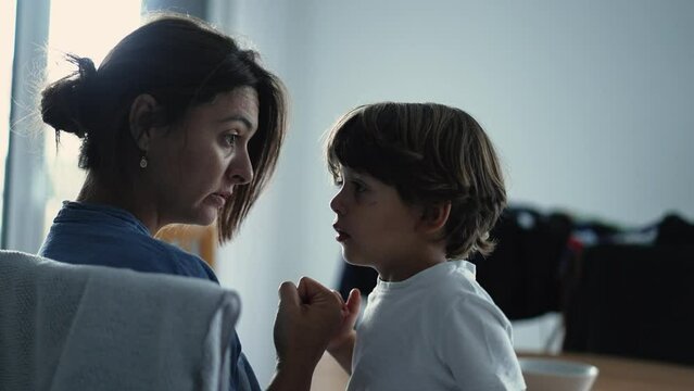 Parent and child pinky swear promise reconciliation. Lifestyle real life mother educating son relationship based on trust. Commitment concept