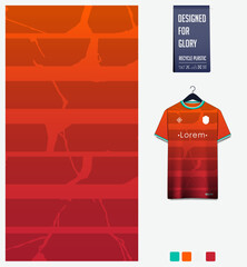 Soccer jersey pattern design. Abstract pattern on orange background for soccer kit, football kit, sports uniform. T shirt mockup template. Fabric pattern. Abstract background. 