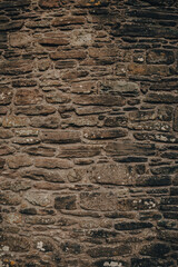 Historic stone wall showcasing traditional craftsmanship in Wales, capturing the essence of ancient architecture