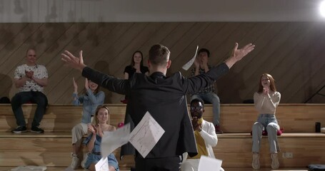 Relax working. Caucasian businessman tossing a bunch of papers celebrating the end of his work and success report. Male relax and happy with work. Business. In Boardroom With Audience Clapping Hands