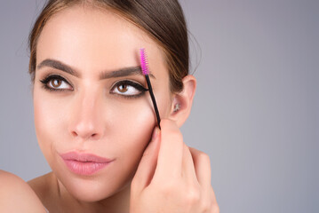 Perfect eyebrows. Natural beauty brows. Eyebrows coloring and lamination. Woman combing eyebrows....