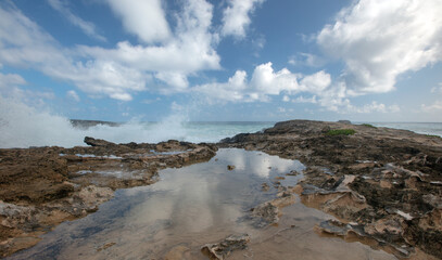 Turbulent storm waves crashing into Laie Point coastline at Kaawa on the North Shore of Oahu Hawaii United States