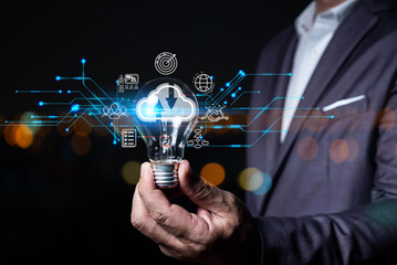 Big data analytics and business intelligence concept with chart and graph icons on a digital screen interface and a businessman in background