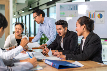 Group of asian business meeting and discussing strategy startup project analysis finance process.Success asian business management work plan and brainstorm marketing idea in office.Teamwork