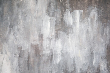 grey paint marks on a brick wall.
