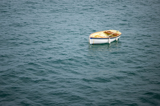 A small boat floating in the sea