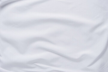 Naklejka premium White fabric. luxurious white fabric texture background. Creases of satin, silk and cotton.
