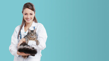 Smiling female vet holding a cute cat