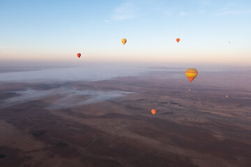 Dreamy hot air balloon ride above the mystical Moroccan desert scenery