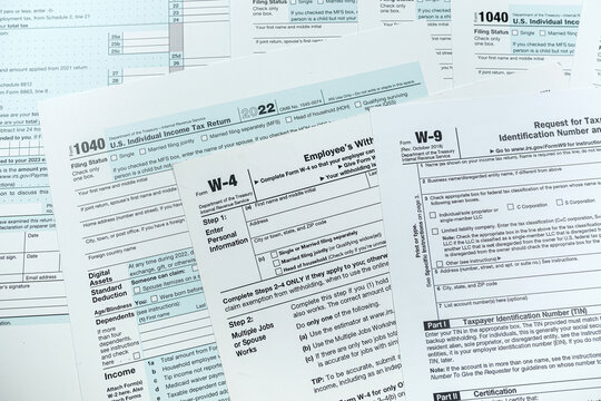 blank tax form 1040 w4 w9 on office desk, deadline