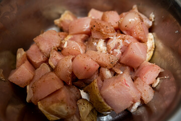 Pieces of pork meat for barbecue marinated in bowl