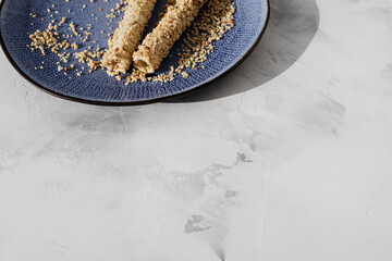 waffle tube with  filling and crushed peanuts