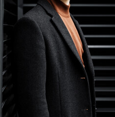 elegant stylish man in coat.