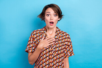 Photo of impressed speechless lady hand touch chest open mouth staring isolated on blue color...