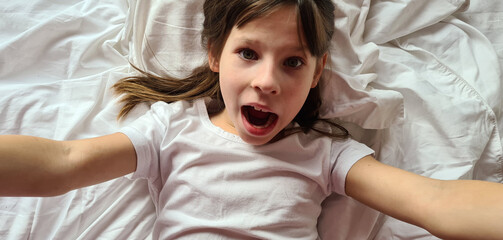 Portrait of little crying screaming girl childish emotions of fear