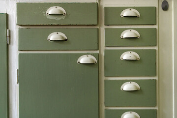 Old vintage wooden kitchen cabinet drawers and handles