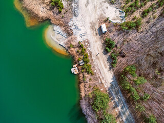 Aerial view landscape. Green water, factory, mining, sand. Photo from a drone.