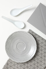 Minimal table setting with blank dish, top view