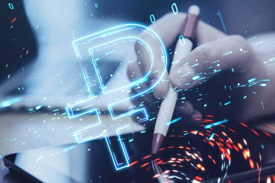 Close up of hand using digital tablet with pen on desktop with digital ruble hologram on blurry background. Trade, finance and money concept. Double exposure.