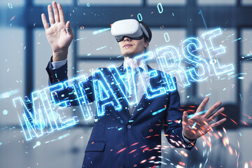 Attractive young european male with VR glasses using glowing metaverse text hologram on blurry office interior tech background. Digital world and future concept. Double exposure.