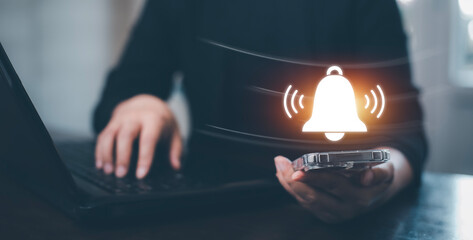 Woman Hand hold smartphone and press the button of Notification bell button on smartphone app screen close up,App Notification on Smart Phone Screen, Remote online alerts, home security signal.