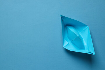 Concept of travel and adventure with paper boat