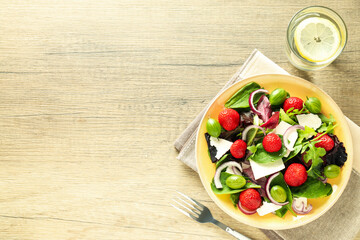 Concept of tasty food, salad with strawberry, space for text