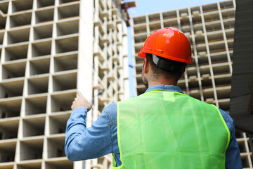 Young man civil engineer in safety hat