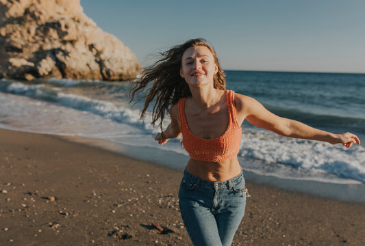 Cheerful woman enjoying at beach