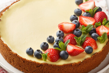 Cheesecake with fresh berries strawberry, blueberry New York dessert. Close up. Horizontal