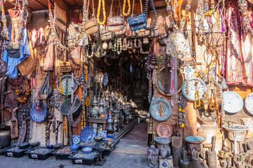 Fototapeta na wymiar Bags and home accessories for sale in a souk in the Medina in Marrakesh Morocco