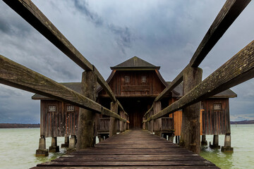 Boathouse in Stegen am Ammersee on a cold windy day with cloudy sky